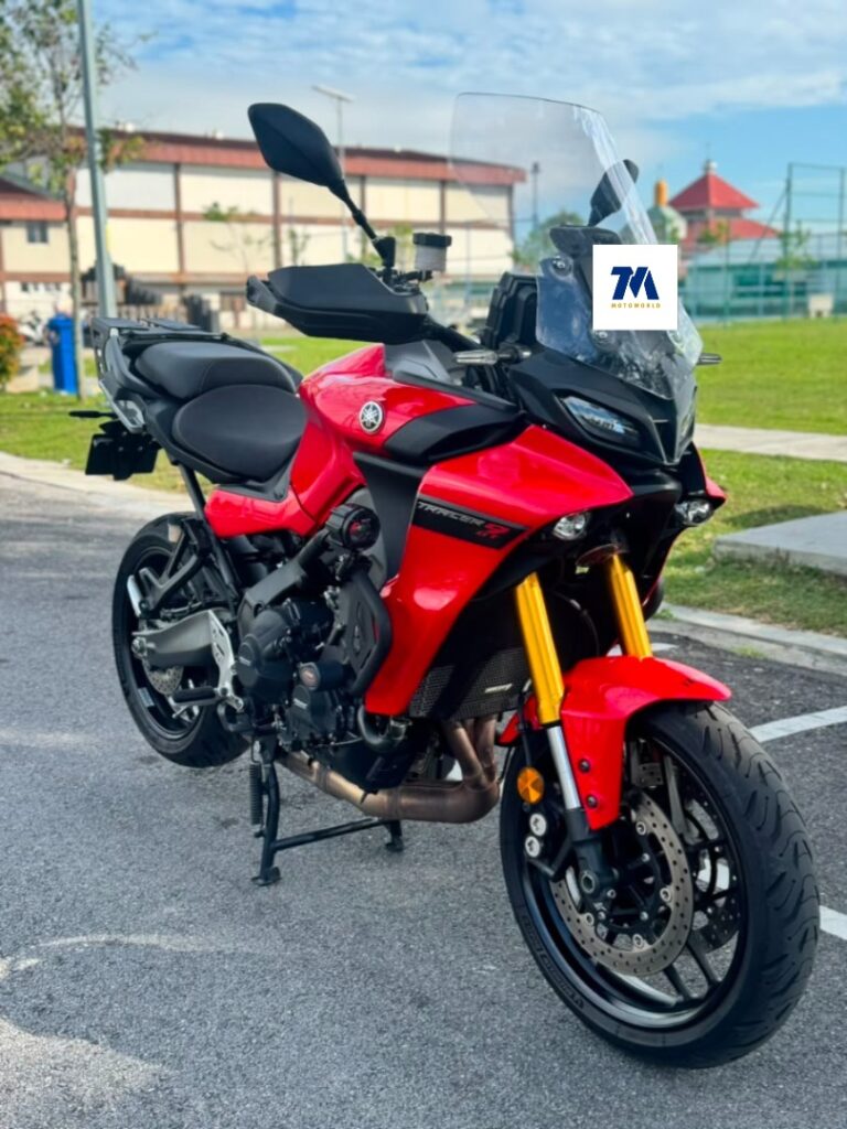 Red motorcycle front view in a parking lot