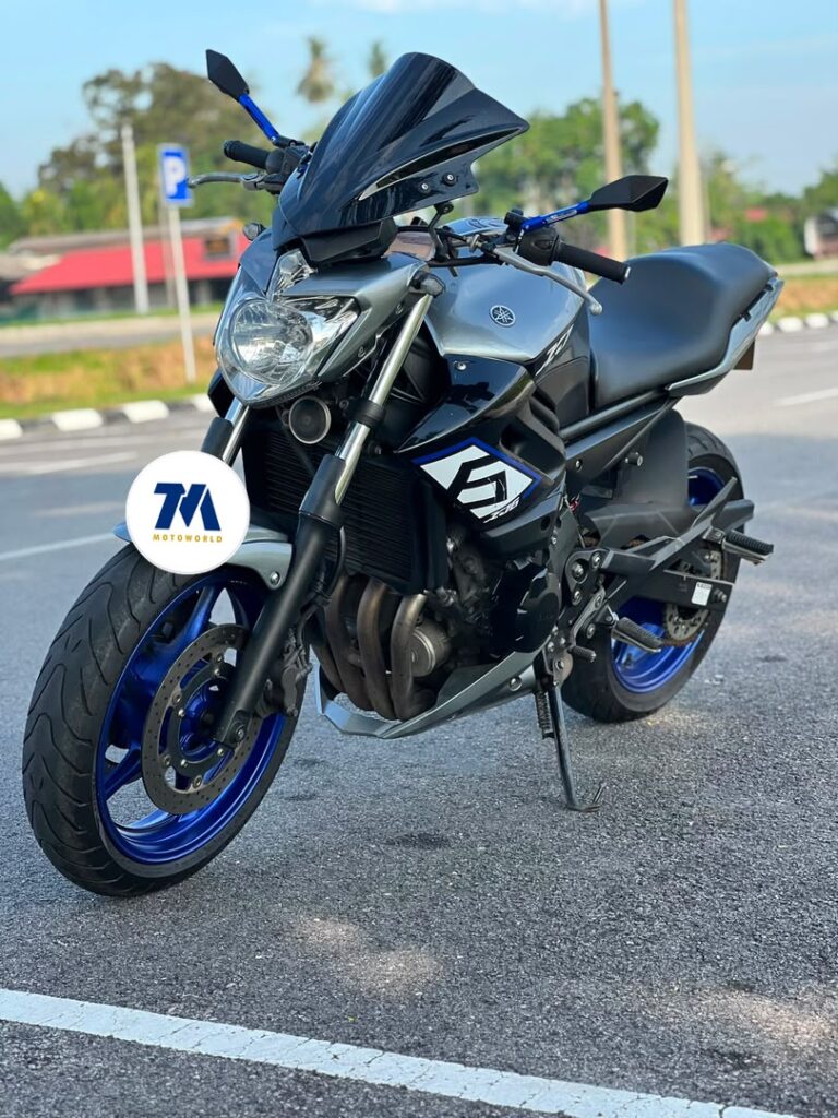Front view of the motorcycle with headlight and handlebars visible.