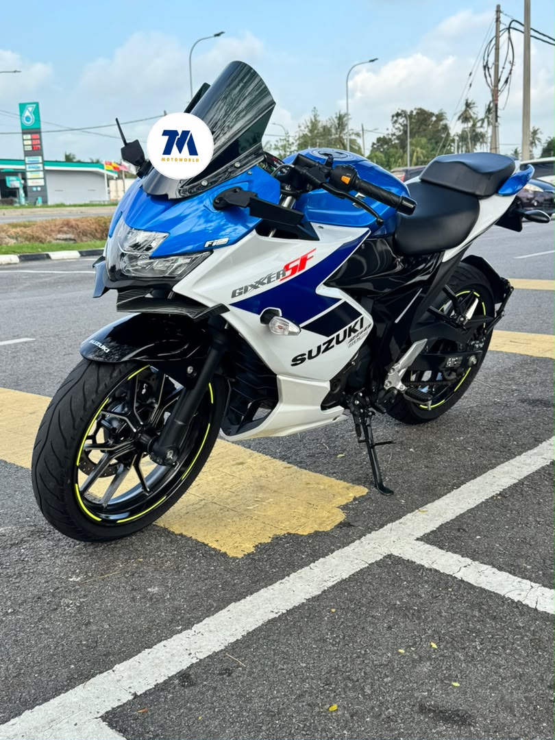 Front 3/4 view of blue and white Suzuki motorcycle
