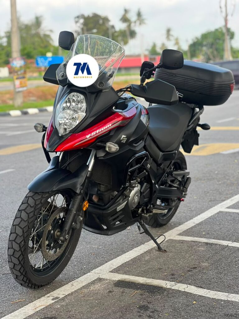 Front view of a motorcycle with red and black fairing.