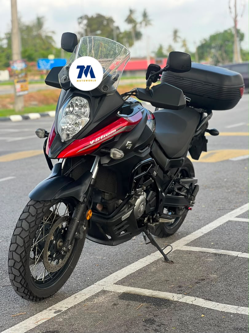 Front view of a motorcycle with red and black fairing.