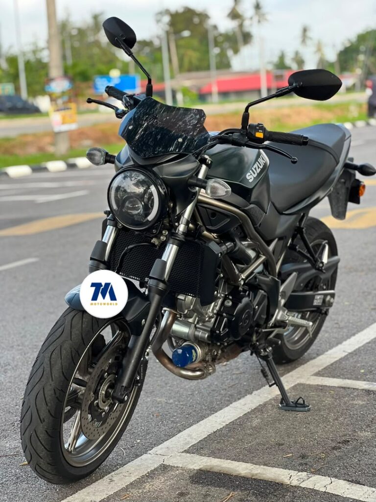 Front 3/4 view of a black motorcycle facing the camera