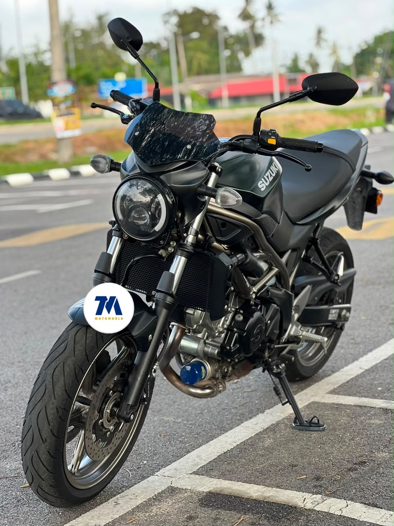 Front 3/4 view of a black motorcycle facing the camera
