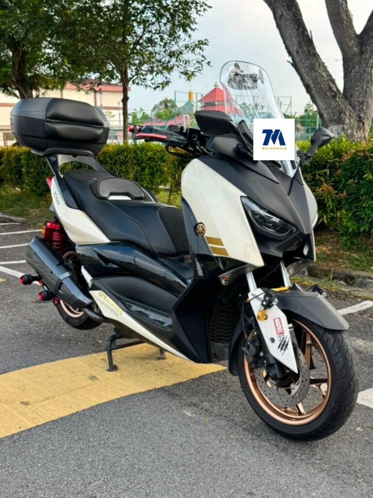Front angled view of the motorcycle, showing headlight and handlebars.