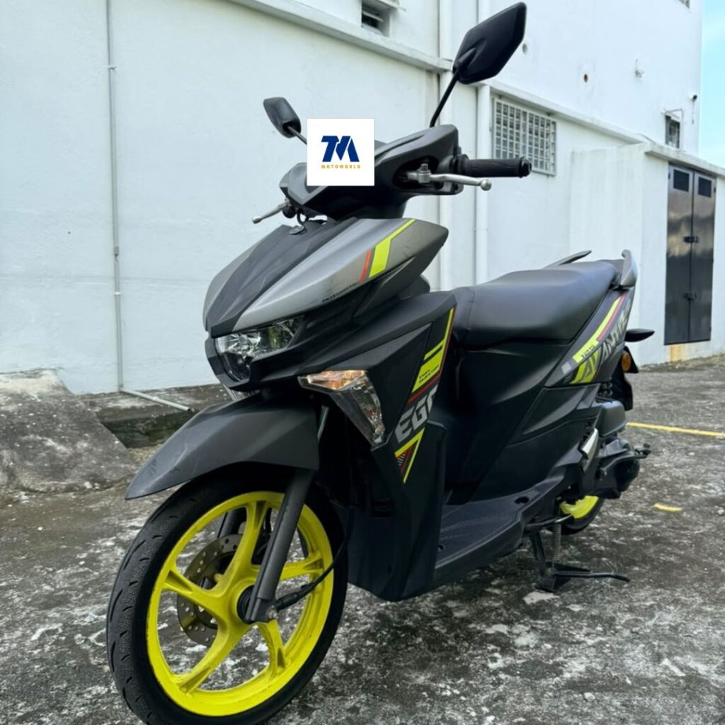 front-facing view of the motorcycle with yellow wheels