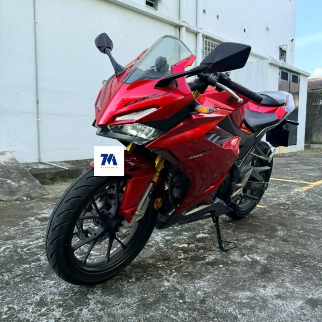 Front 3/4 view of a red motorcycle