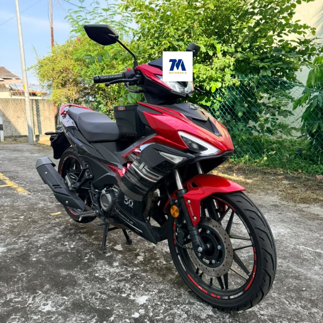 Front-3/4 view of a red and black motorcycle facing the camera