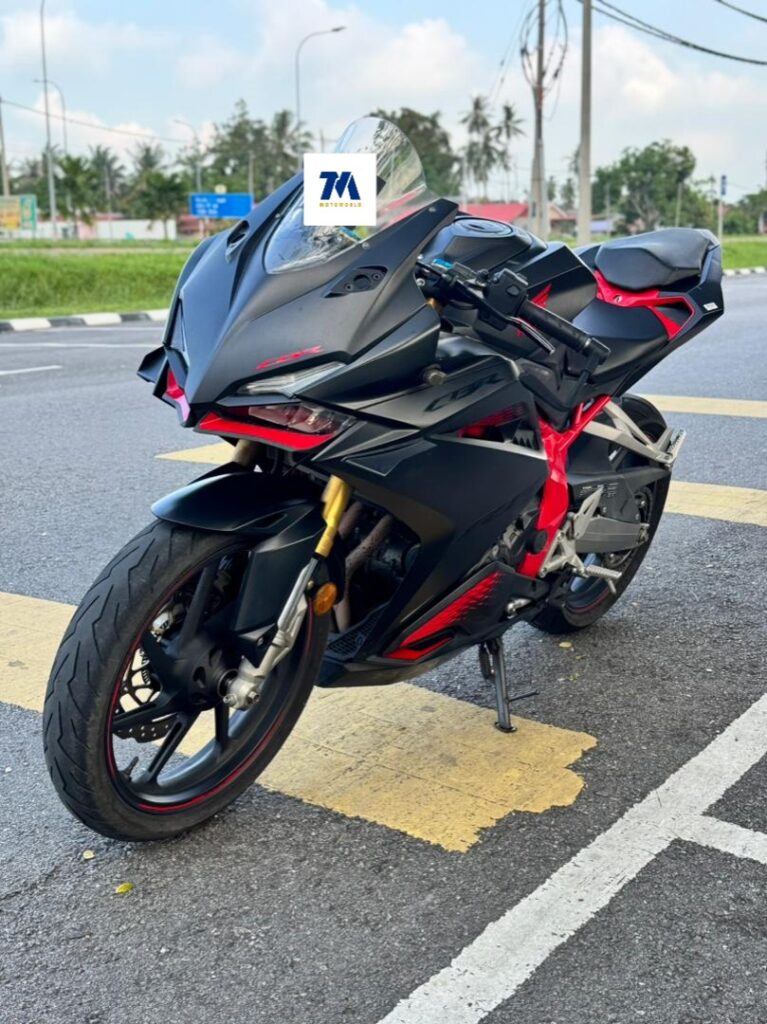 Front-3/4 view of a black and red motorcycle