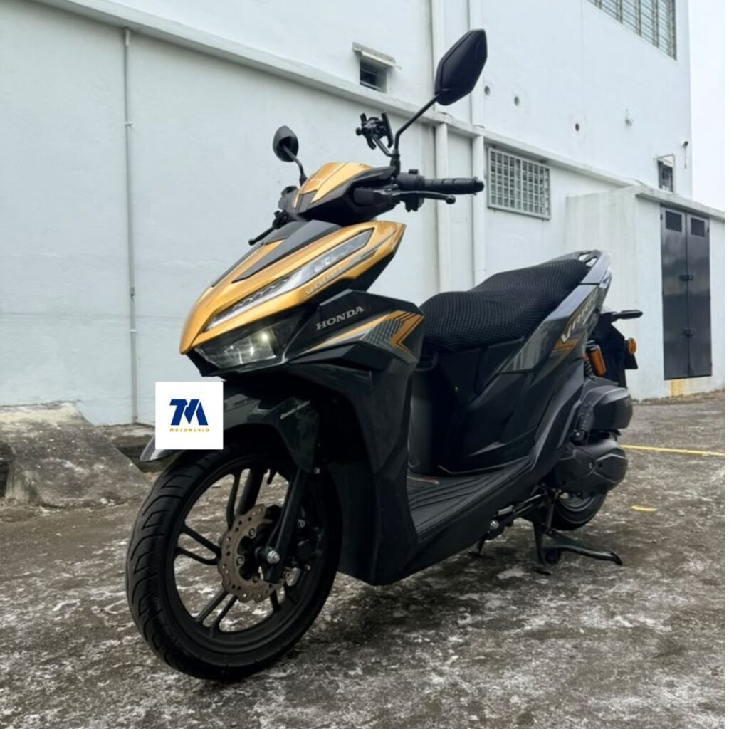 Front-facing view of a gold and black Honda motorcycle