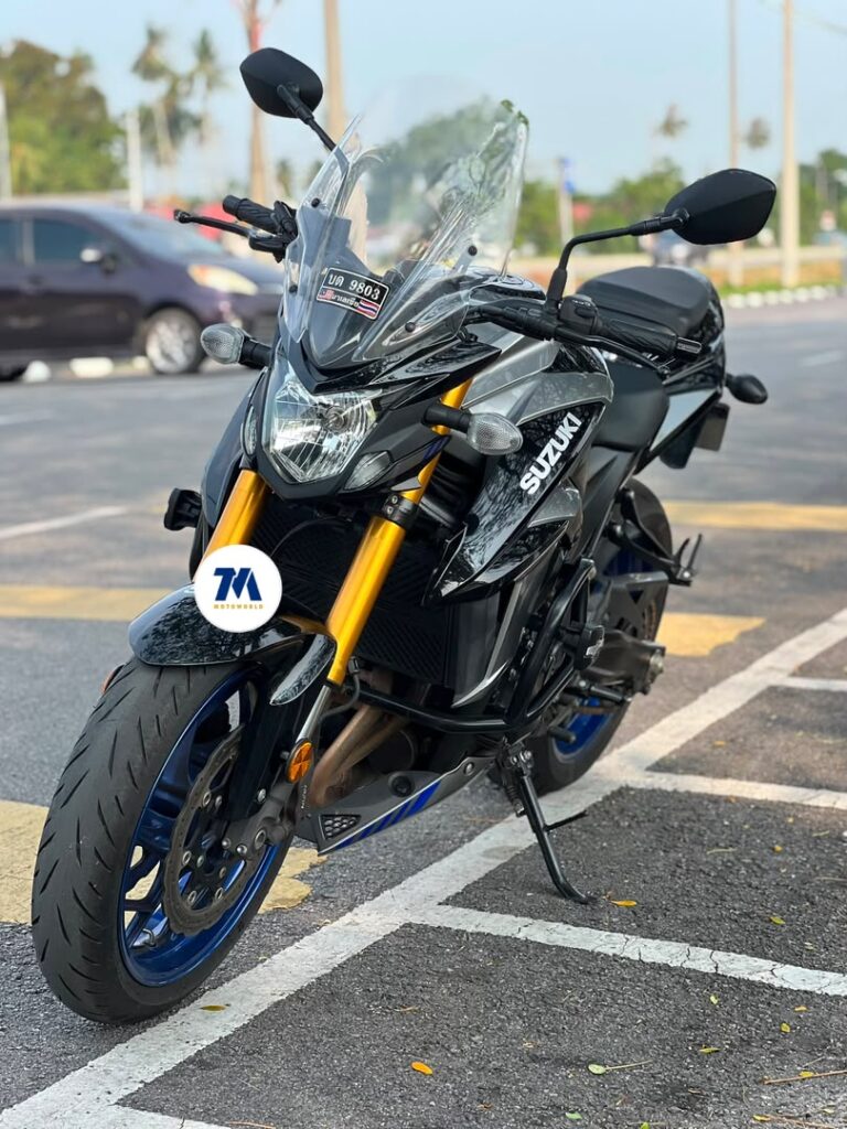 front view of the motorcycle with headlight, fairing, and handlebars visible