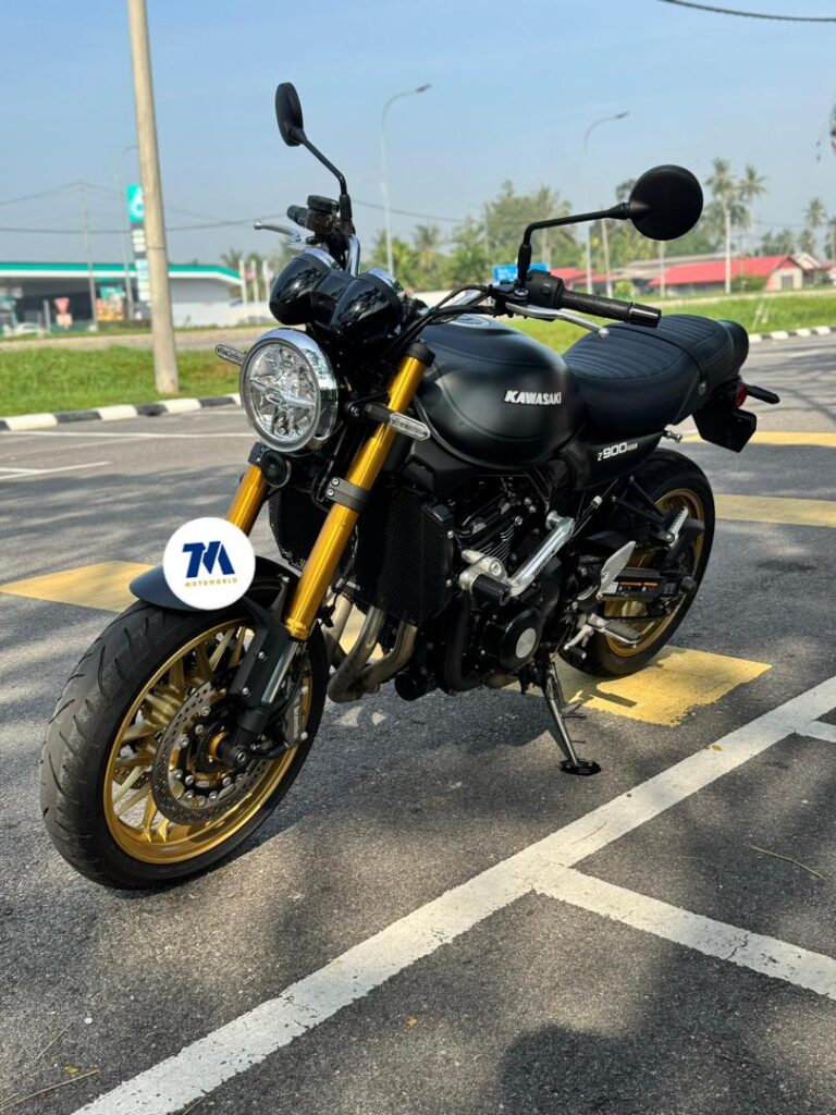 Front-three-quarter view of the motorcycle showing headlight and handlebars