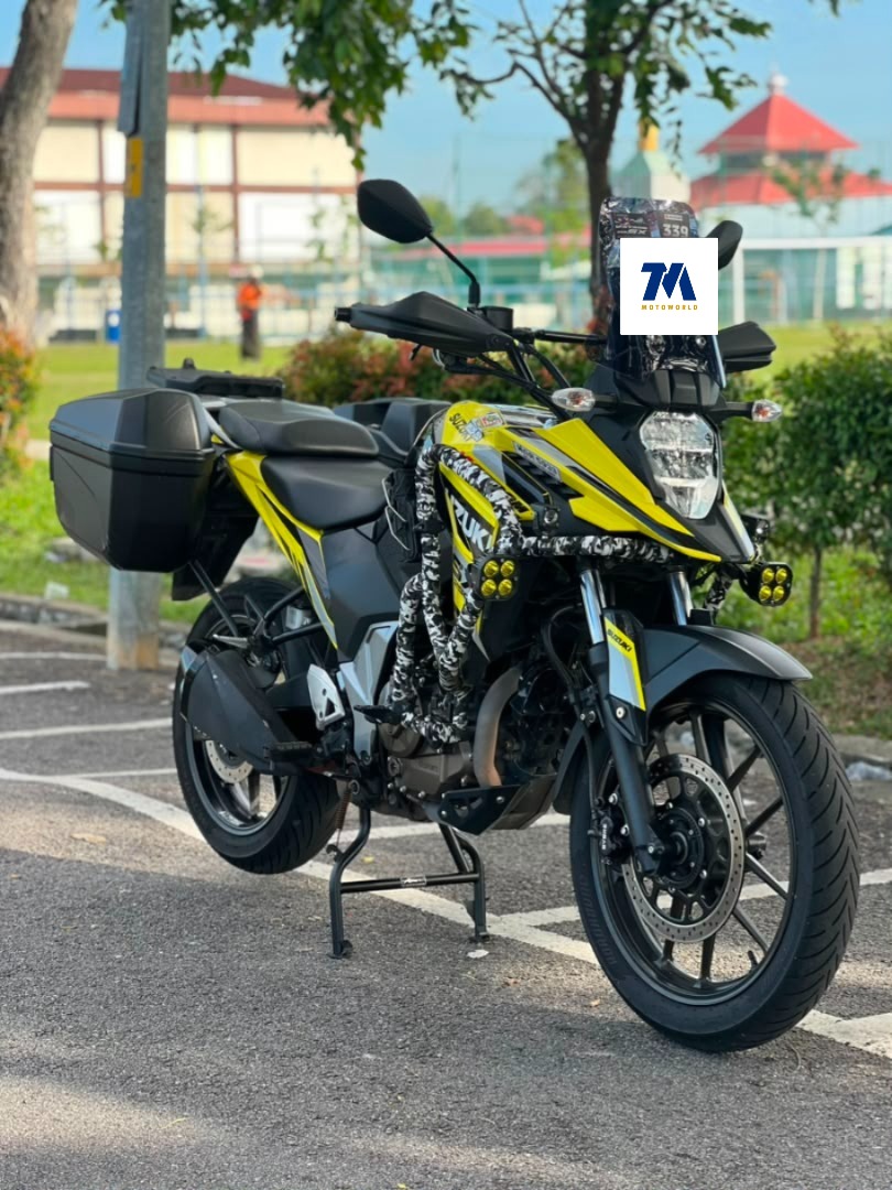 Front view of the Suzuki V-Strom SX in yellow with a headlight and front fairing visible