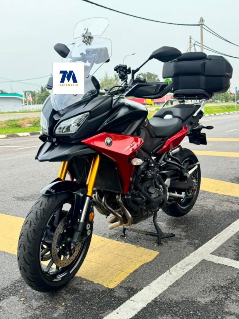 Yamaha Tracer 900GT in striking orange-red, front-3/4 view