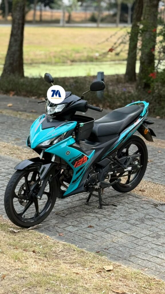Yamaha 135LC V8 motorcycle, front view with teal color