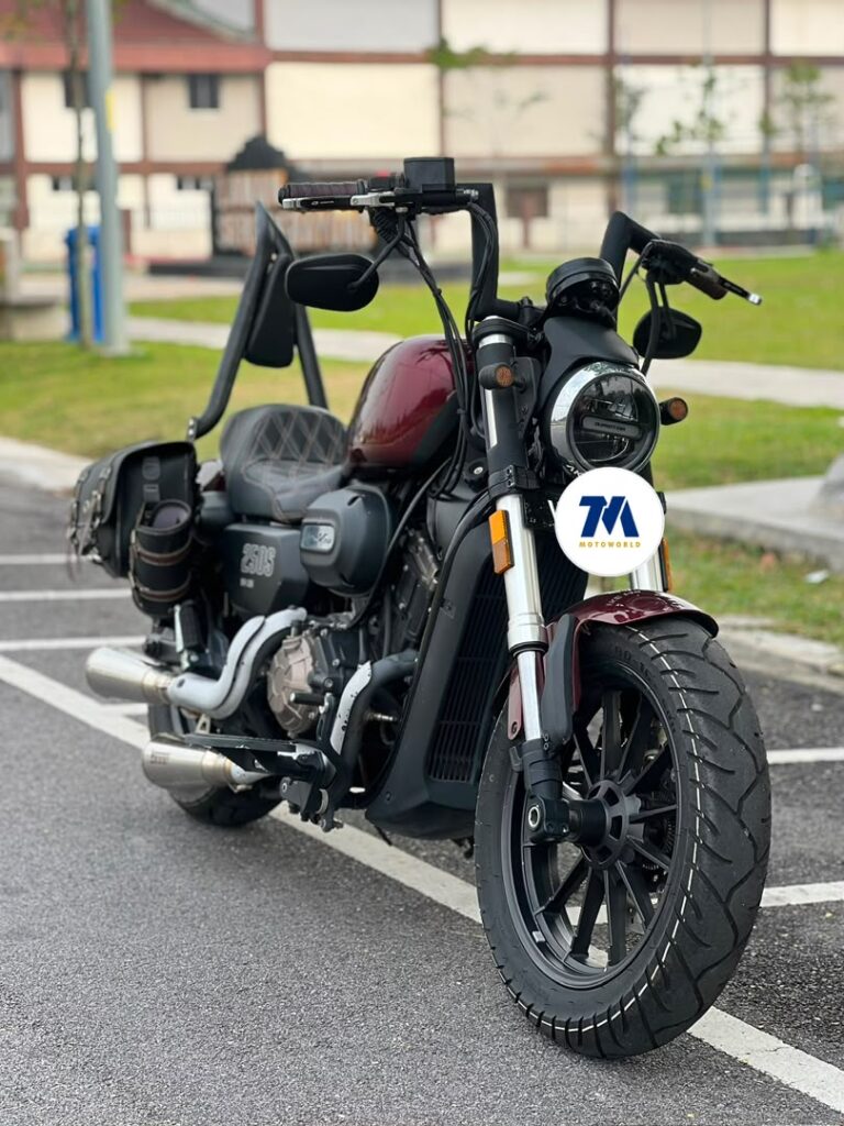 Front view of the QJMOTO SRV 250 motorcycle, showcasing its headlight and handlebars.