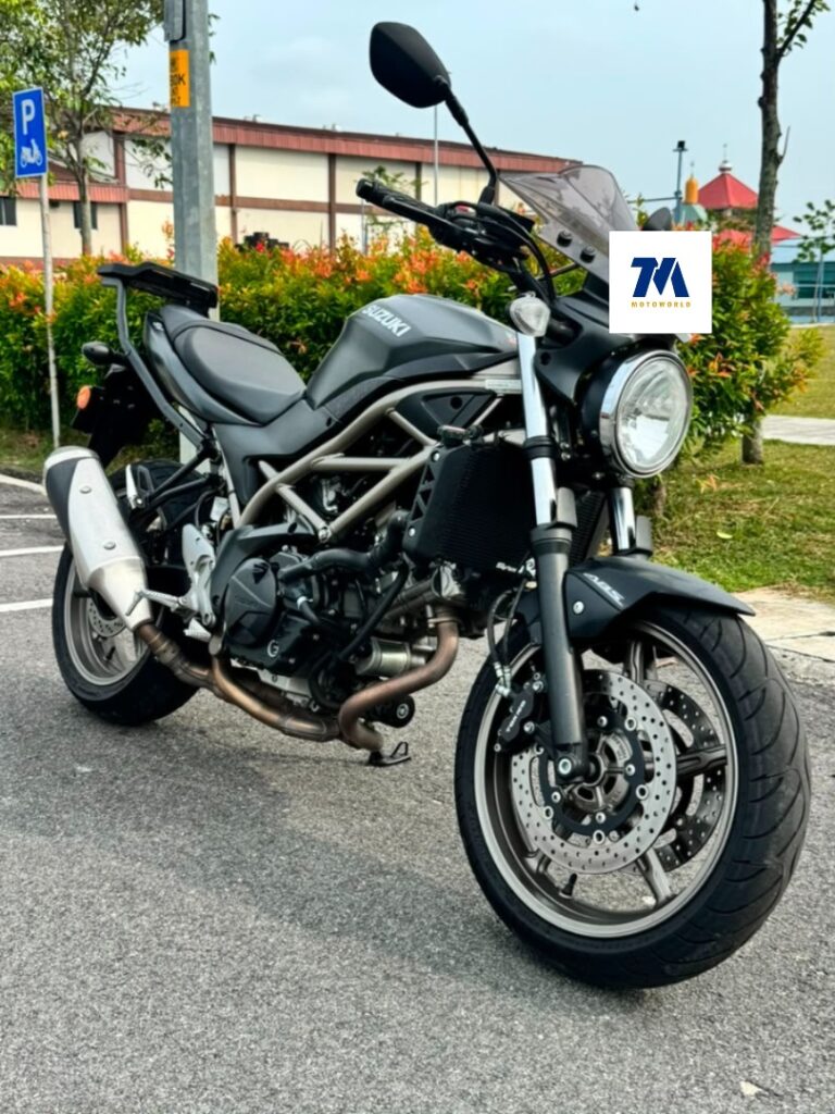 Suzuki SV650 front view motorcycle with headlight toward camera