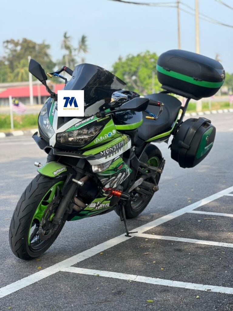 Front 3/4 view of a Kawasaki ER6F motorcycle with 3 boxes