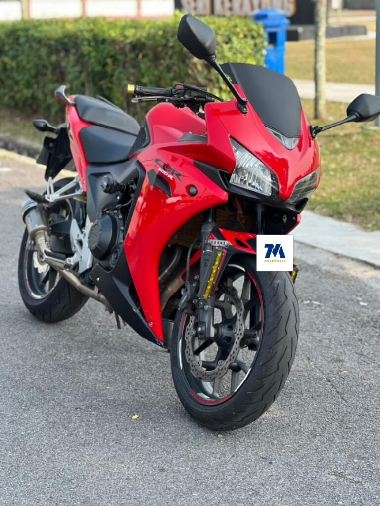 Front-3/4 view of a red Honda CBR500R facing the camera