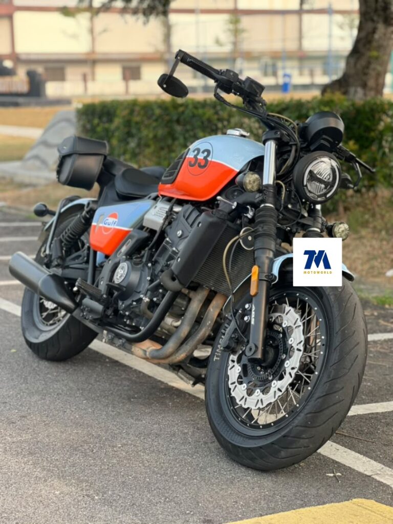 front view of WMOTO Bobbie 450S motorcycle with distinctive orange and grey color