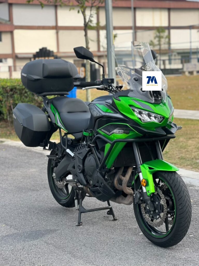 front 3/4 view of a Kawasaki Versys 650 with green color and panniers
