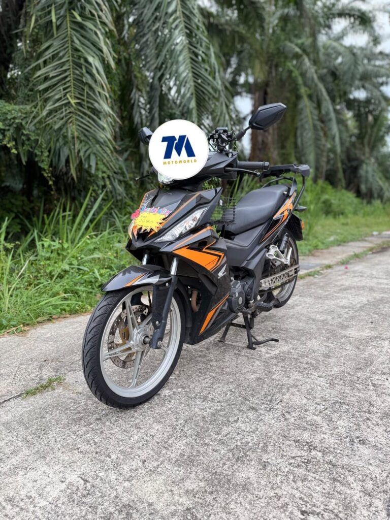front view of a black and orange Honda RS150R motorcycle