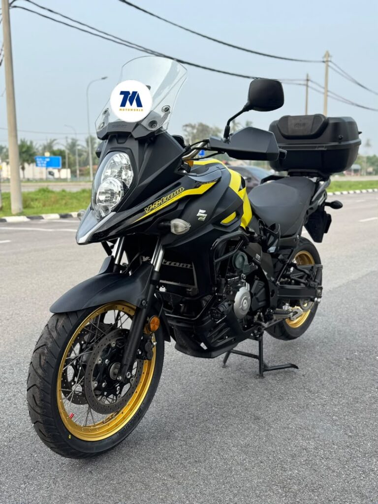 Front view of a black and yellow Suzuki V-Strom 650 motorcycle
