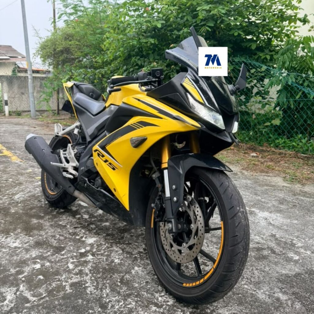 Front 3/4 view of yellow Yamaha R15 motorcycle