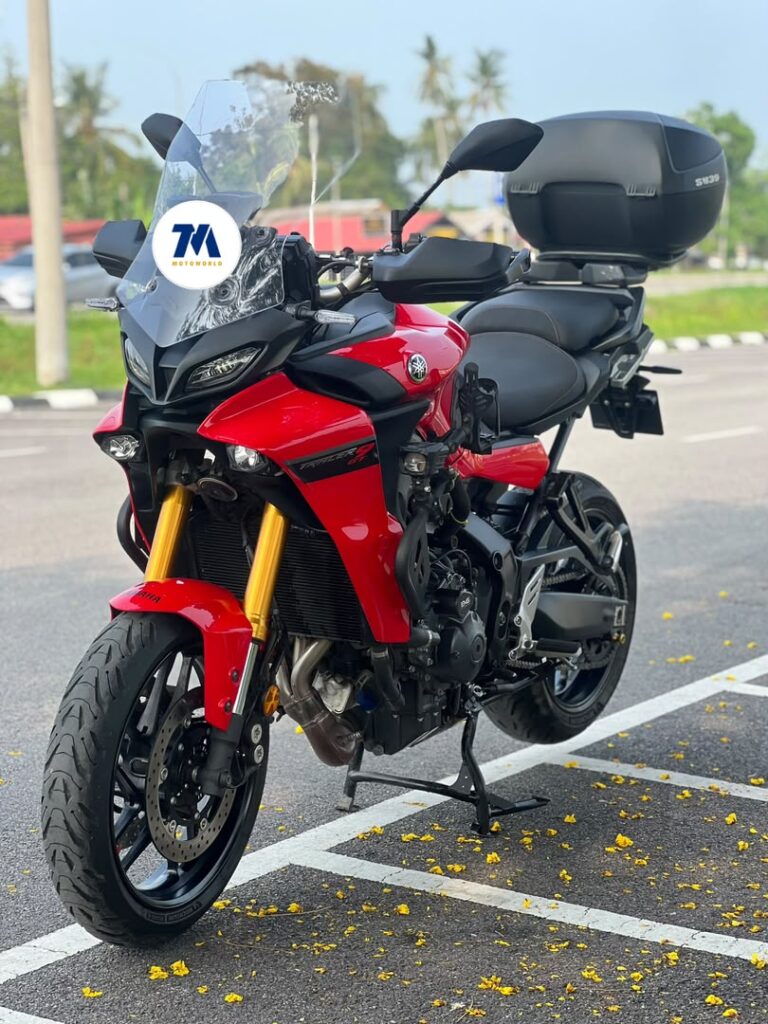 Front view of a red Yamaha Tracer 9 GT with top box