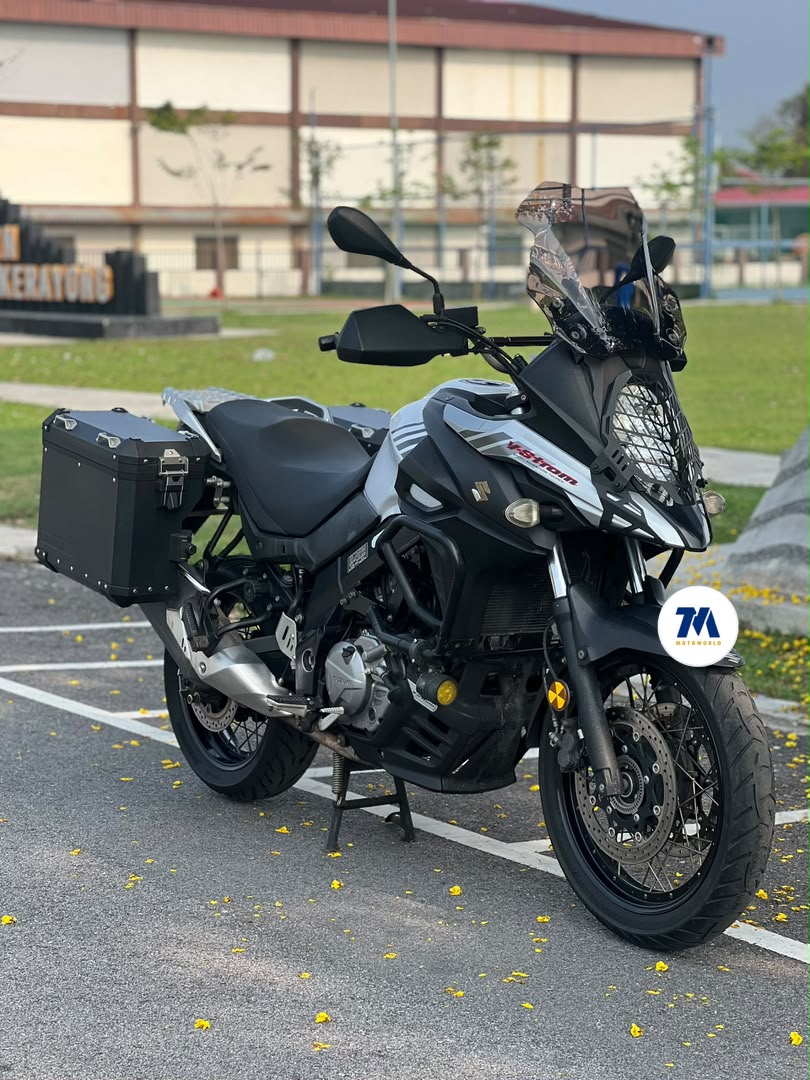 Suzuki Vstrom 650 motorcycle facing forward with windshield and panniers