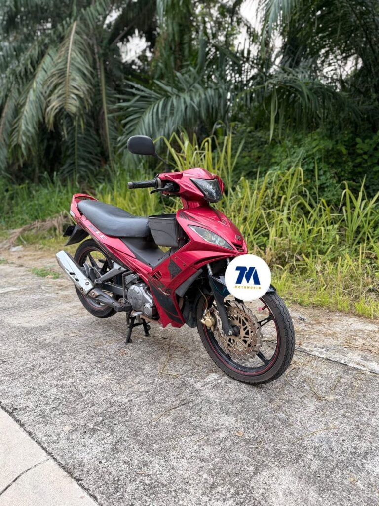 front 3/4 view of red Yamaha LC135 V1 motorcycle