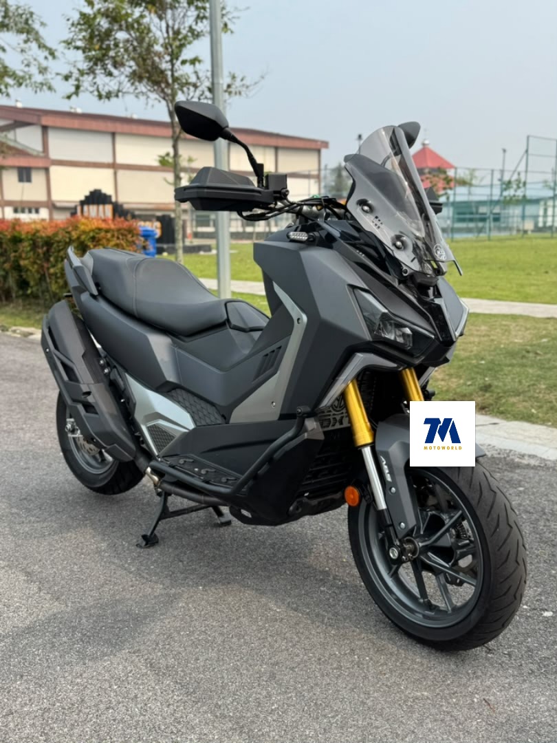 Front view of a black SYM ADXTG 400 motorcycle