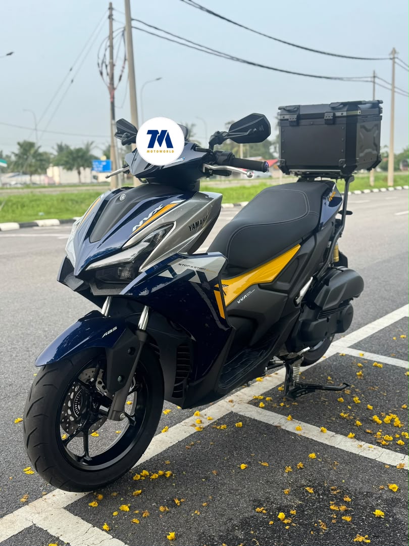 front view of a blue and yellow Yamaha NVX 155 V3 motorcycle