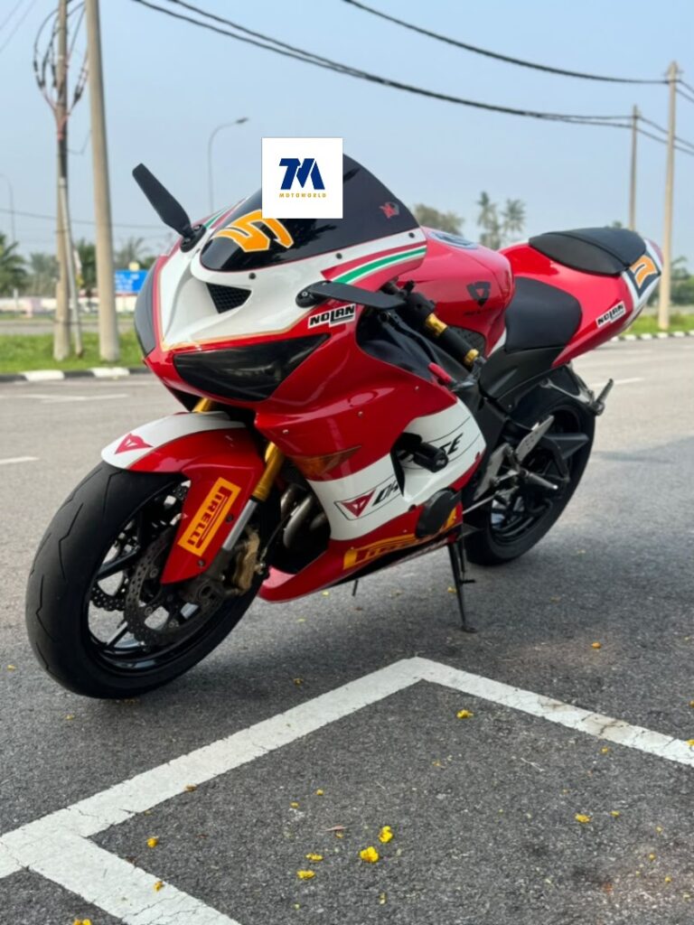 Front 3/4 view of red Kawasaki ZX6 RR motorcycle